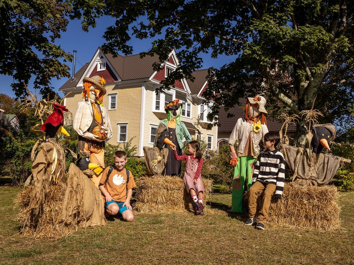 Handmade scarecrows along Main Street during the Scarecrow Festival